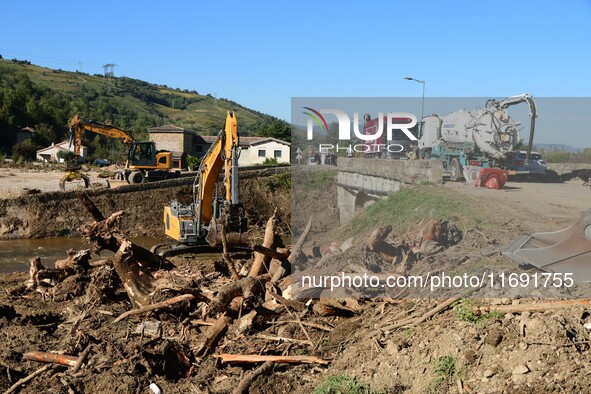 Several volunteers and residents participate in the restoration of the village of Limony in Ardeche, France, on October 21, 2024, after the...