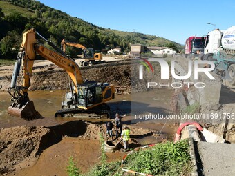 Several volunteers and residents participate in the restoration of the village of Limony in Ardeche, France, on October 21, 2024, after the...