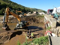 Several volunteers and residents participate in the restoration of the village of Limony in Ardeche, France, on October 21, 2024, after the...