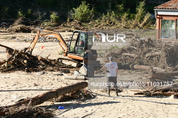 Several volunteers and residents participate in the restoration of the village of Limony in Ardeche, France, on October 21, 2024, after the...