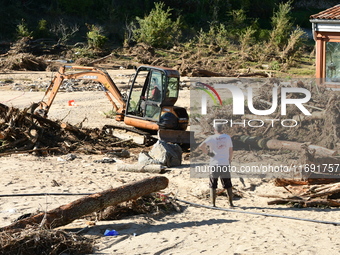 Several volunteers and residents participate in the restoration of the village of Limony in Ardeche, France, on October 21, 2024, after the...