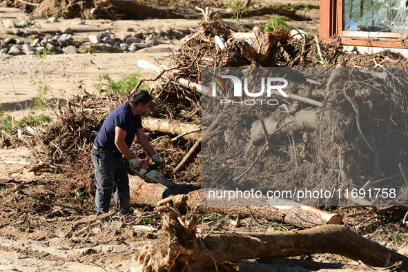 Several volunteers and residents participate in the restoration of the village of Limony in Ardeche, France, on October 21, 2024, after the...