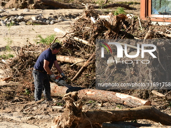 Several volunteers and residents participate in the restoration of the village of Limony in Ardeche, France, on October 21, 2024, after the...