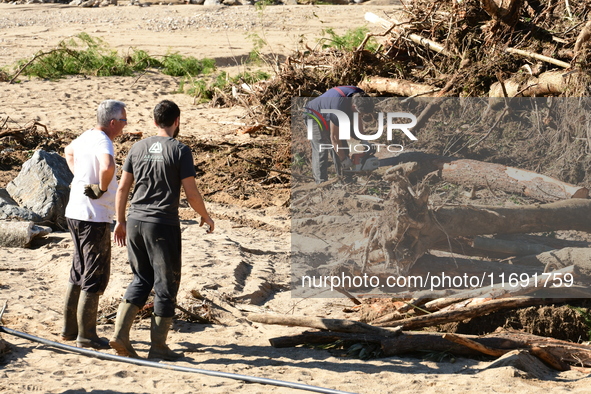 Several volunteers and residents participate in the restoration of the village of Limony in Ardeche, France, on October 21, 2024, after the...