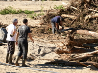 Several volunteers and residents participate in the restoration of the village of Limony in Ardeche, France, on October 21, 2024, after the...