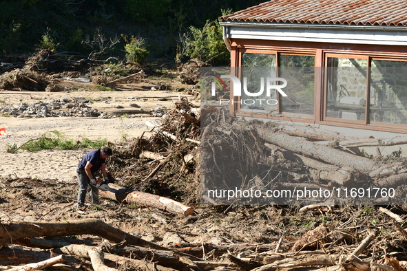 Several volunteers and residents participate in the restoration of the village of Limony in Ardeche, France, on October 21, 2024, after the...