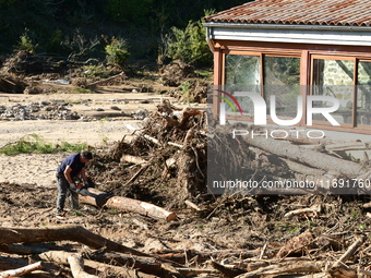 Several volunteers and residents participate in the restoration of the village of Limony in Ardeche, France, on October 21, 2024, after the...