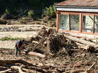 Several volunteers and residents participate in the restoration of the village of Limony in Ardeche, France, on October 21, 2024, after the...