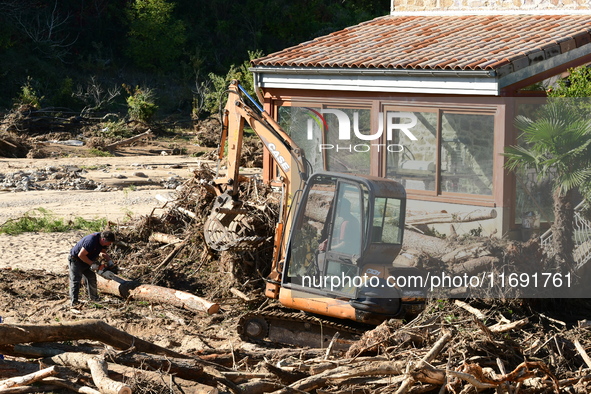 Several volunteers and residents participate in the restoration of the village of Limony in Ardeche, France, on October 21, 2024, after the...