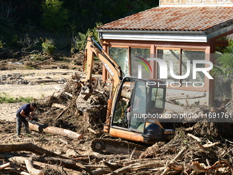 Several volunteers and residents participate in the restoration of the village of Limony in Ardeche, France, on October 21, 2024, after the...