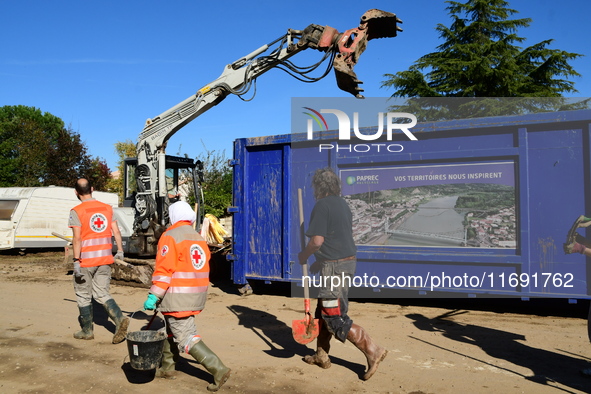 Several volunteers and residents participate in the restoration of the village of Limony in Ardeche, France, on October 21, 2024, after the...