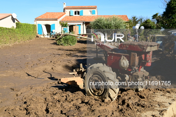 Several volunteers and residents participate in the restoration of the village of Limony in Ardeche, France, on October 21, 2024, after the...