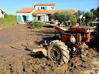 Several volunteers and residents participate in the restoration of the village of Limony in Ardeche, France, on October 21, 2024, after the...