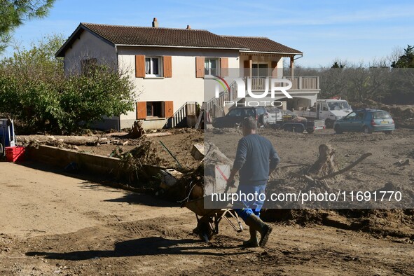 Several volunteers and residents participate in the restoration of the village of Limony in Ardeche, France, on October 21, 2024, after the...