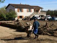 Several volunteers and residents participate in the restoration of the village of Limony in Ardeche, France, on October 21, 2024, after the...