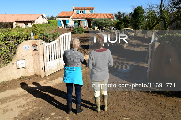 Several volunteers and residents participate in the restoration of the village of Limony in Ardeche, France, on October 21, 2024, after the...