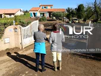 Several volunteers and residents participate in the restoration of the village of Limony in Ardeche, France, on October 21, 2024, after the...