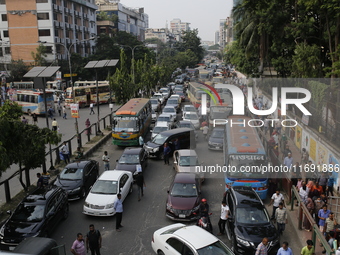 People are stuck in a traffic jam in Dhaka, Bangladesh, on October 21, 2024. (