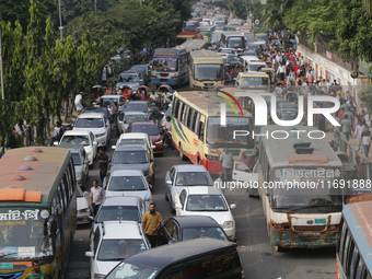 People are stuck in a traffic jam in Dhaka, Bangladesh, on October 21, 2024. (