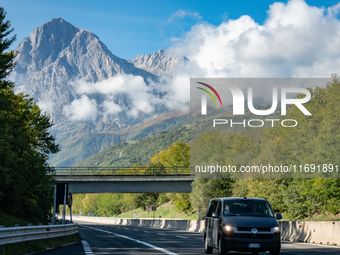 A vehicle crossing A24 highway is seen in the province of Teramo, Italy, on October 12th, 2024. Gran Sasso peaks (Corno Grande and Corno Pic...