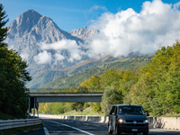 A vehicle crossing A24 highway is seen in the province of Teramo, Italy, on October 12th, 2024. Gran Sasso peaks (Corno Grande and Corno Pic...