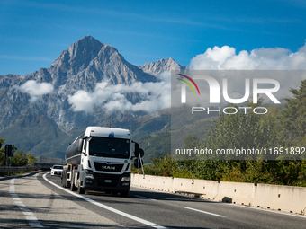 Vehicles crossing A24 highway are seen in the province of Teramo, Italy, on October 12th, 2024. Gran Sasso peaks (Corno Grande and Corno Pic...