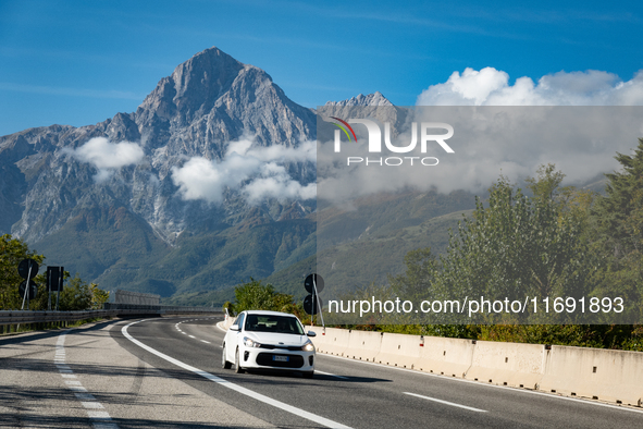 A vehicle crossing A24 highway are seen in the province of Teramo, Italy, on October 12th, 2024. Gran Sasso peaks (Corno Grande and Corno Pi...