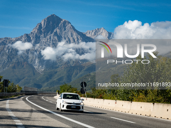 A vehicle crossing A24 highway are seen in the province of Teramo, Italy, on October 12th, 2024. Gran Sasso peaks (Corno Grande and Corno Pi...