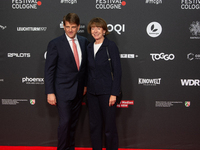 Henriette Reker, the mayor of Cologne, and Leopold Hoesch, the film producer, are seen on the red carpet during the photocall of ''Die Unbeu...