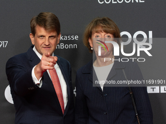 Henriette Reker, the mayor of Cologne, and Leopold Hoesch, the film producer, are seen on the red carpet during the photocall of ''Die Unbeu...