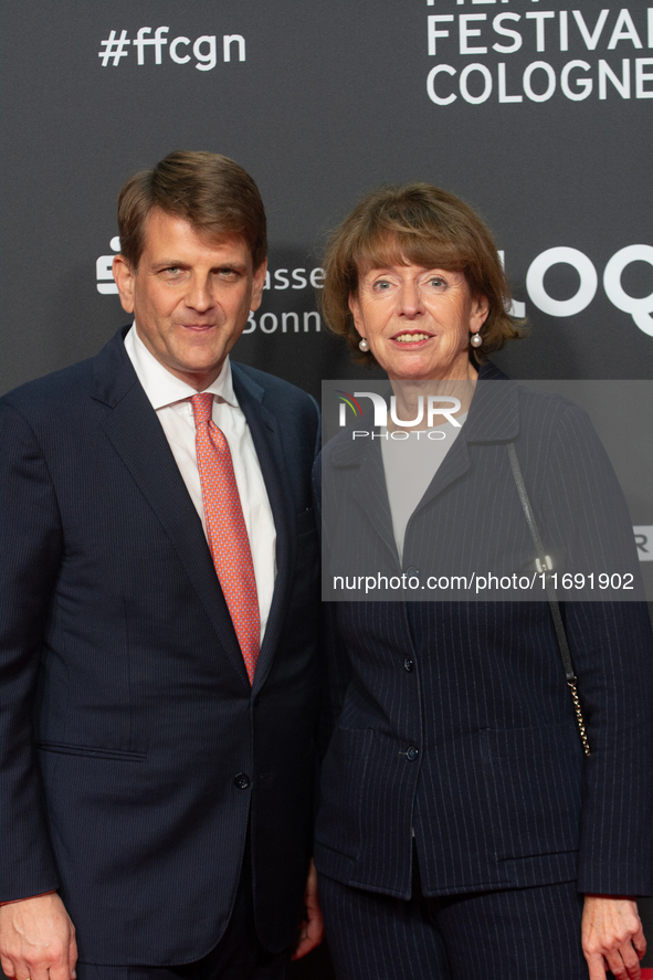 Henriette Reker, the mayor of Cologne, and Leopold Hoesch, the film producer, are seen on the red carpet during the photocall of ''Die Unbeu...