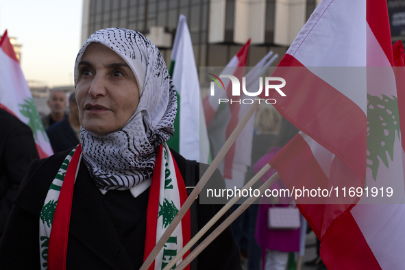 Demonstrators wave flags of Lebanon and Palestine during a rally titled 'Give Peace a Chance' in Sofia, Bulgaria, on October 21, 2024, again...