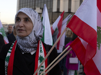 Demonstrators wave flags of Lebanon and Palestine during a rally titled 'Give Peace a Chance' in Sofia, Bulgaria, on October 21, 2024, again...