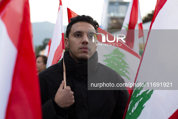 Demonstrators wave flags of Lebanon and Palestine during a rally titled 'Give Peace a Chance' in Sofia, Bulgaria, on October 21, 2024, again...