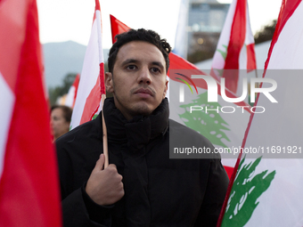 Demonstrators wave flags of Lebanon and Palestine during a rally titled 'Give Peace a Chance' in Sofia, Bulgaria, on October 21, 2024, again...