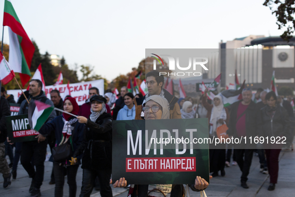 Demonstrators wave flags of Lebanon and Palestine during a rally titled 'Give Peace a Chance' in Sofia, Bulgaria, on October 21, 2024, again...