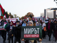 Demonstrators wave flags of Lebanon and Palestine during a rally titled 'Give Peace a Chance' in Sofia, Bulgaria, on October 21, 2024, again...