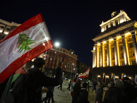 Demonstrators wave flags of Lebanon and Palestine during a rally titled 'Give Peace a Chance' in Sofia, Bulgaria, on October 21, 2024, again...