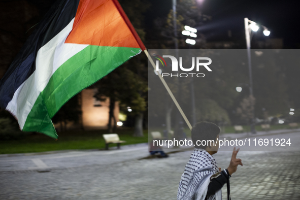 Demonstrators wave flags of Lebanon and Palestine during a rally titled 'Give Peace a Chance' in Sofia, Bulgaria, on October 21, 2024, again...