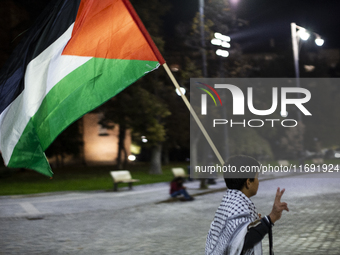 Demonstrators wave flags of Lebanon and Palestine during a rally titled 'Give Peace a Chance' in Sofia, Bulgaria, on October 21, 2024, again...