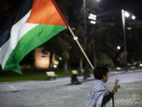 Demonstrators wave flags of Lebanon and Palestine during a rally titled 'Give Peace a Chance' in Sofia, Bulgaria, on October 21, 2024, again...