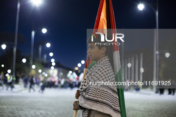 Demonstrators wave flags of Lebanon and Palestine during a rally titled 'Give Peace a Chance' in Sofia, Bulgaria, on October 21, 2024, again...