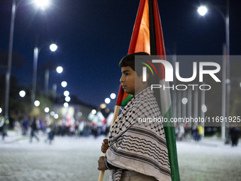 Demonstrators wave flags of Lebanon and Palestine during a rally titled 'Give Peace a Chance' in Sofia, Bulgaria, on October 21, 2024, again...