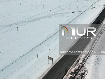 Heavy snow brought by strong cold air falls on the north slope of Tianshan Mountain in Hami, China, on October 20, 2024. (