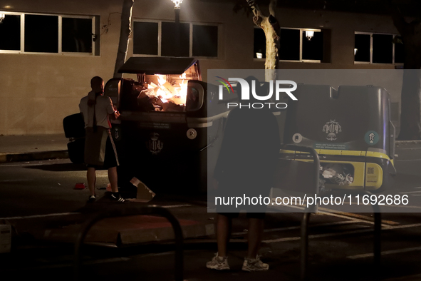 Several Valencia CF ultras confront the police by throwing objects and burning rubbish containers after losing against UD Las Palmas in a La...