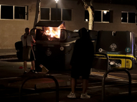 Several Valencia CF ultras confront the police by throwing objects and burning rubbish containers after losing against UD Las Palmas in a La...