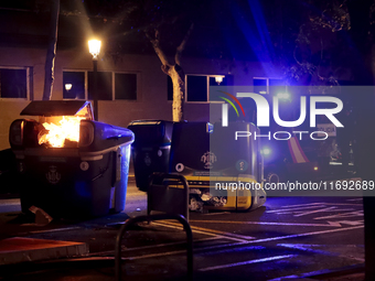 Several Valencia CF ultras confront the police by throwing objects and burning rubbish containers after losing against UD Las Palmas in a La...