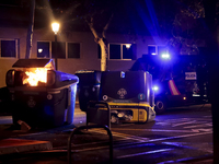 Several Valencia CF ultras confront the police by throwing objects and burning rubbish containers after losing against UD Las Palmas in a La...