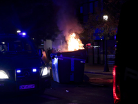 Several Valencia CF ultras confront the police by throwing objects and burning rubbish containers after losing against UD Las Palmas in a La...