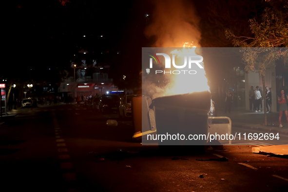 Several Valencia CF ultras confront the police by throwing objects and burning rubbish containers after losing against UD Las Palmas in a La...